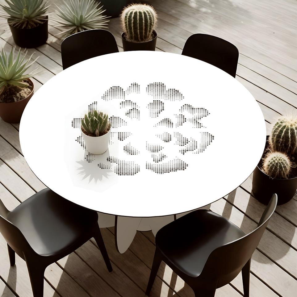Table ronde d'extérieur avec des perforations en forme de fleurs. Collection Gardenia Marque Ibride Design
